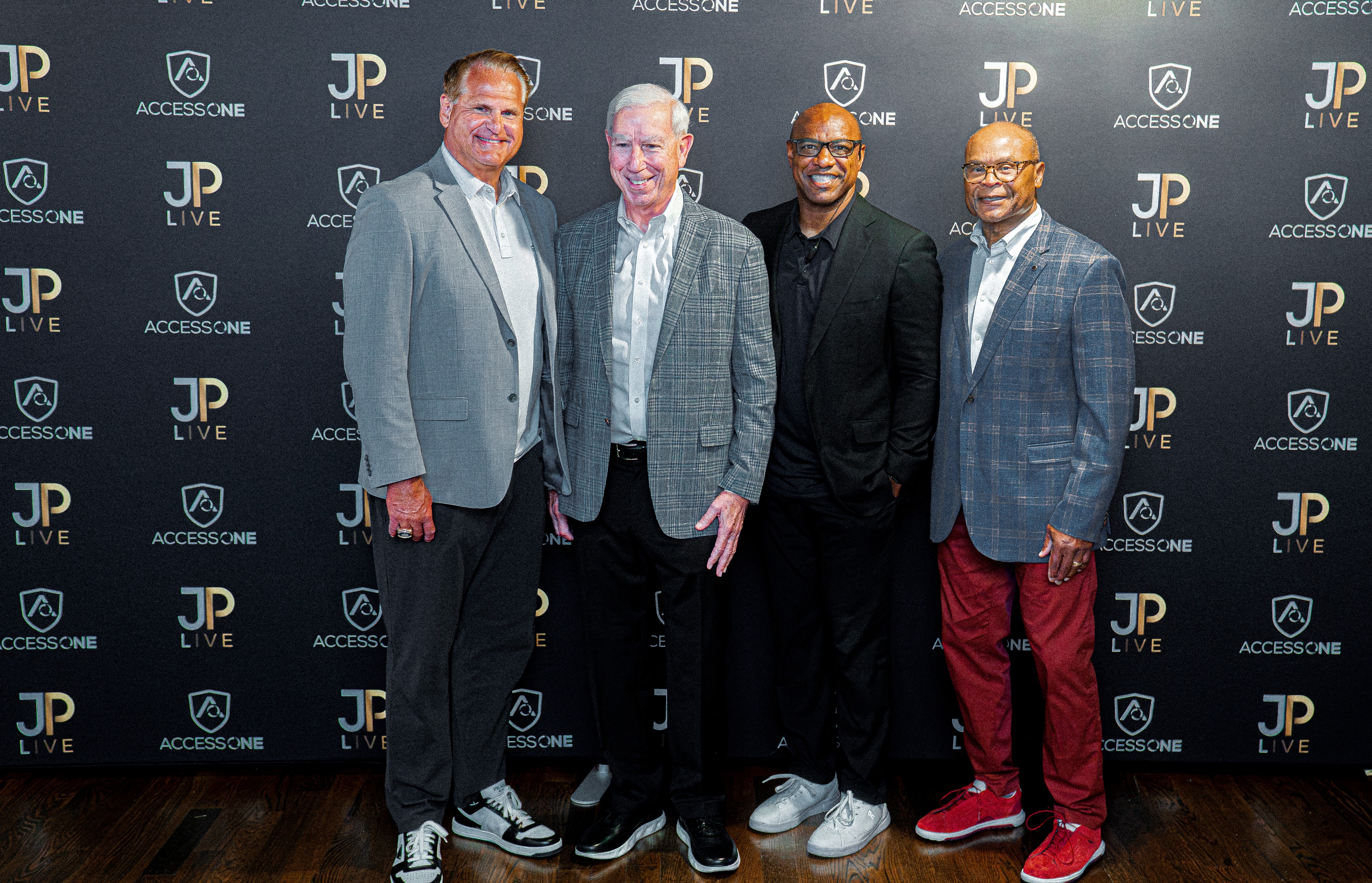 JP LIVE guests at the branded backdrop with AccessOne
